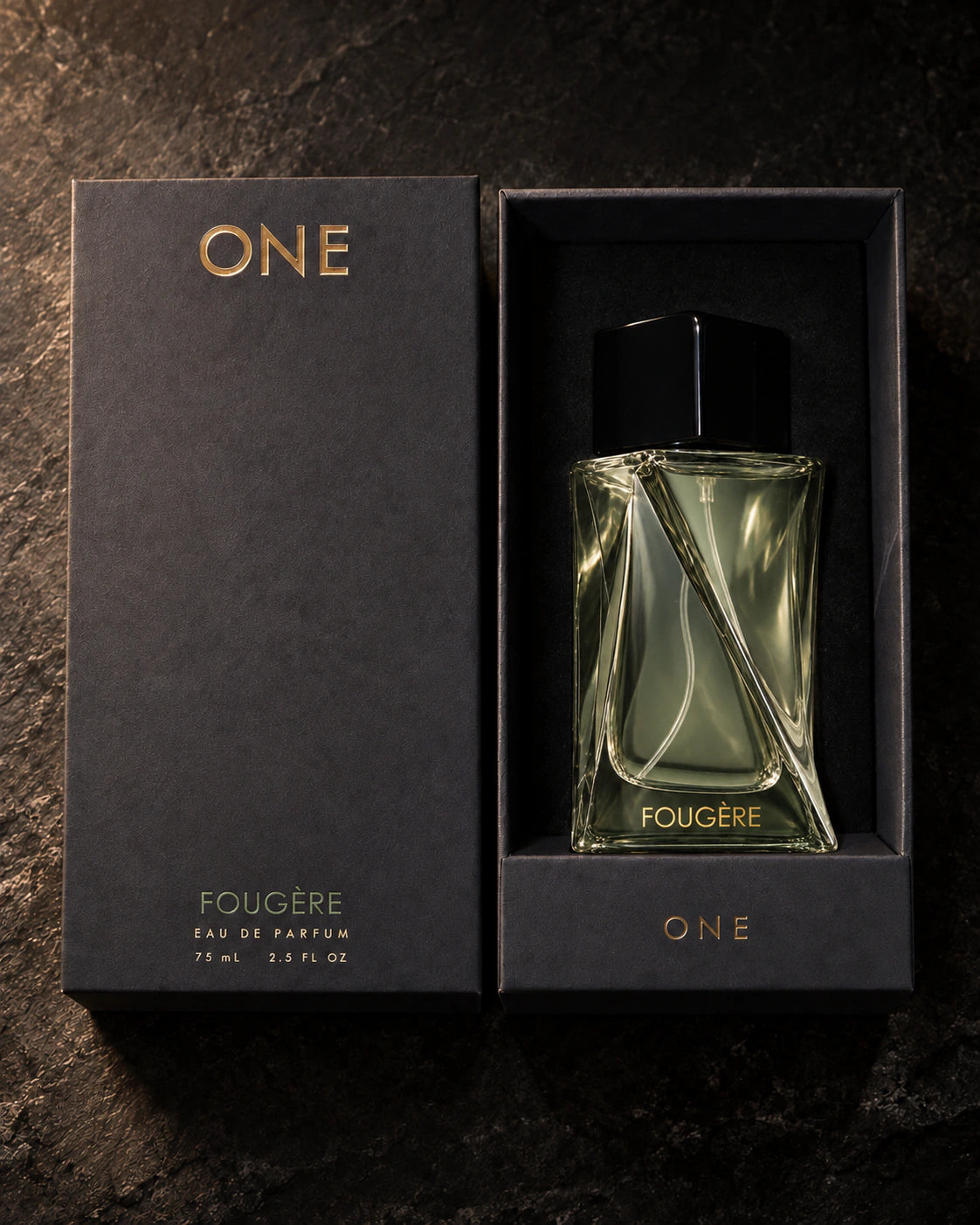 Fougère 75 ml bottle in its fitted black presentation box beside the charcoal lid with ONE branding