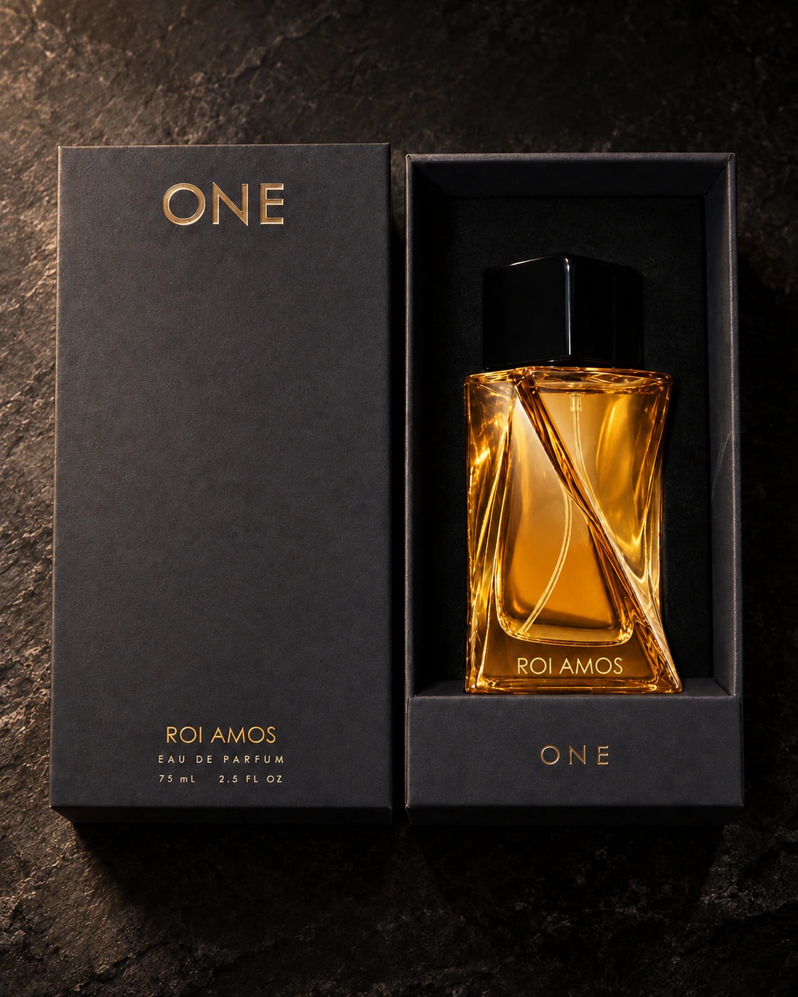 Roi Amos 75 ml bottle in its fitted black presentation box beside the charcoal lid with ONE branding