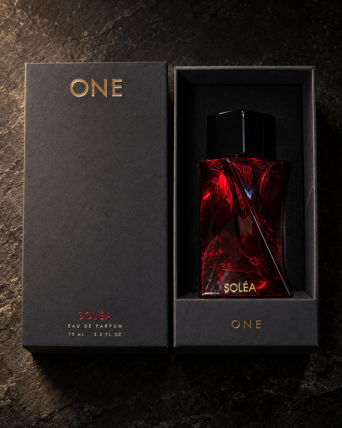 SOLÉA 75 ml bottle in its fitted black presentation box beside the charcoal lid with ONE branding