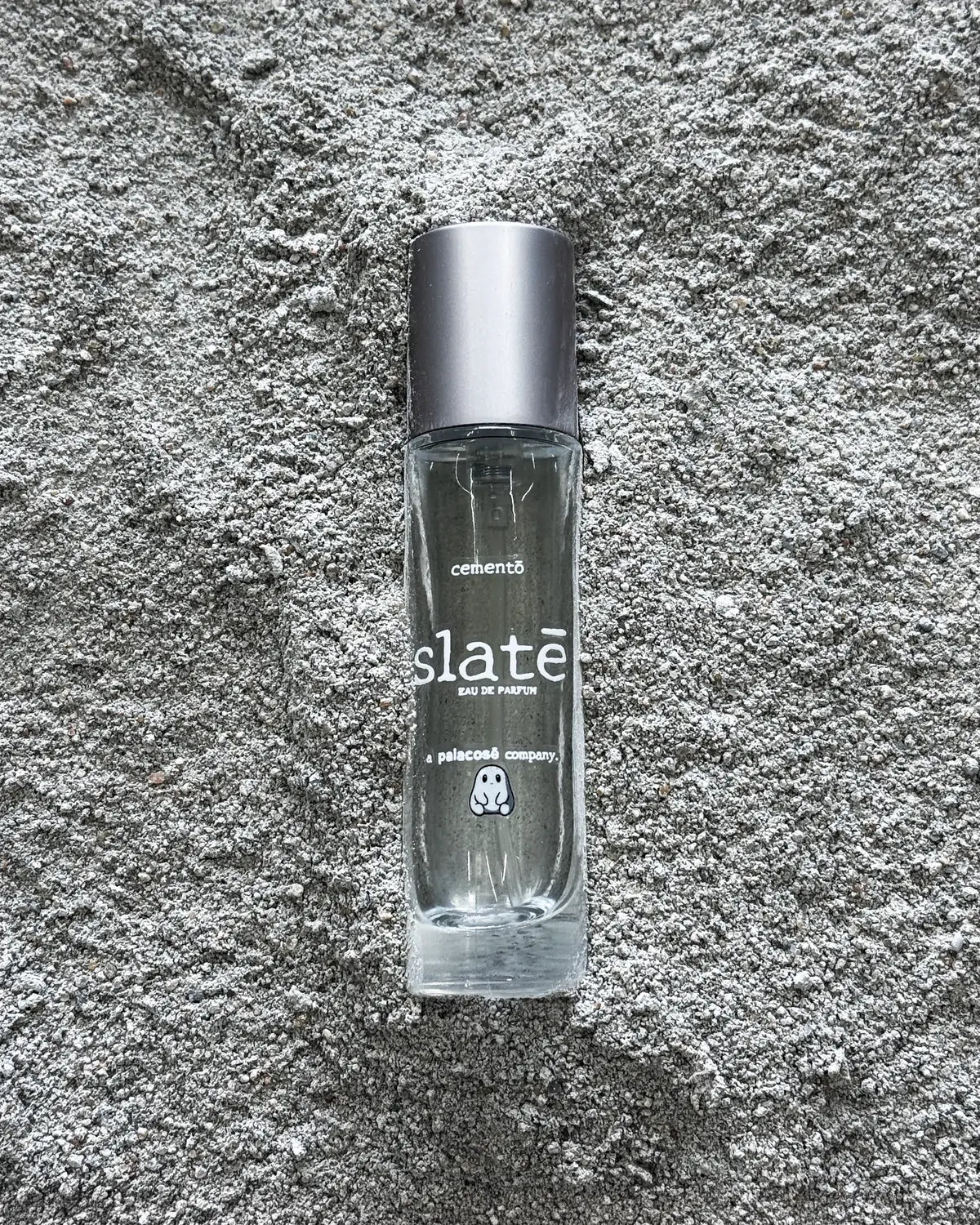 SLATE eau de parfum for cementō, a Palacose company, photographed on textured stone